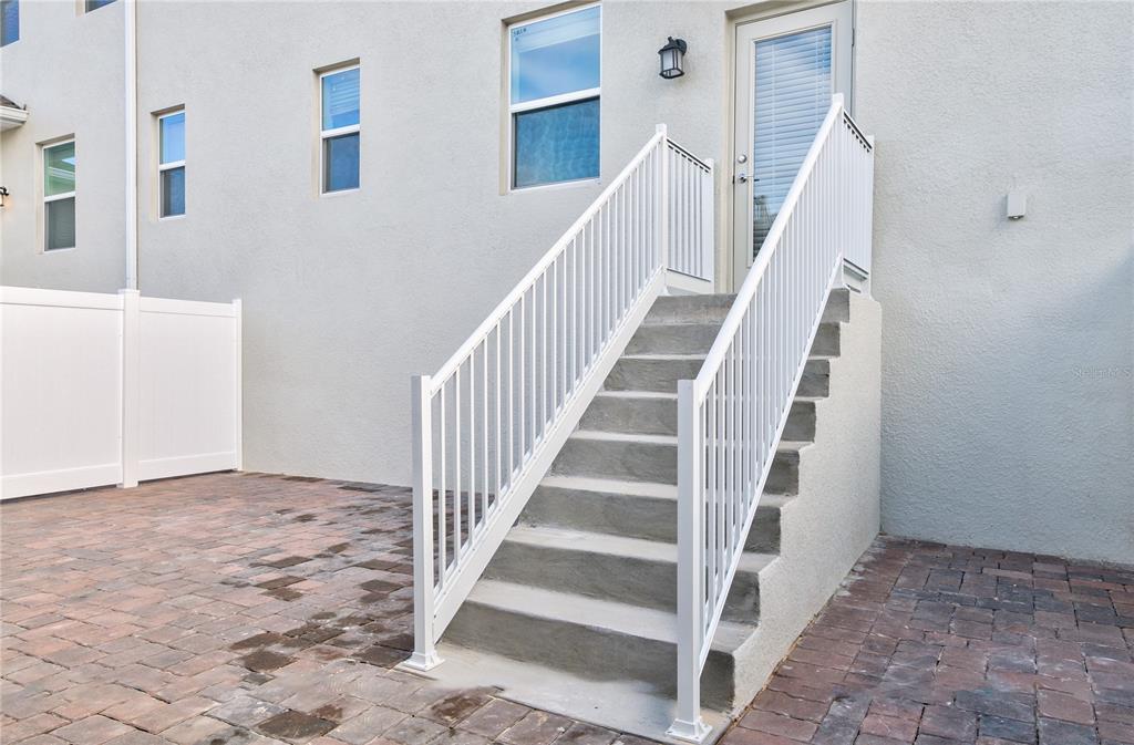 15627 Water Spring Boulevard Winter Garden, FL 34787 - Photo 34 of 45 a view of staircase with white walls and white walls