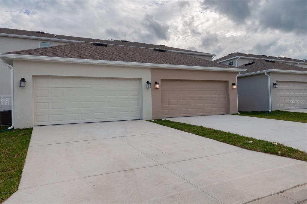 15627 Water Spring Boulevard Winter Garden, FL 34787 - Photo 44 of 45 a front view of a house with garage