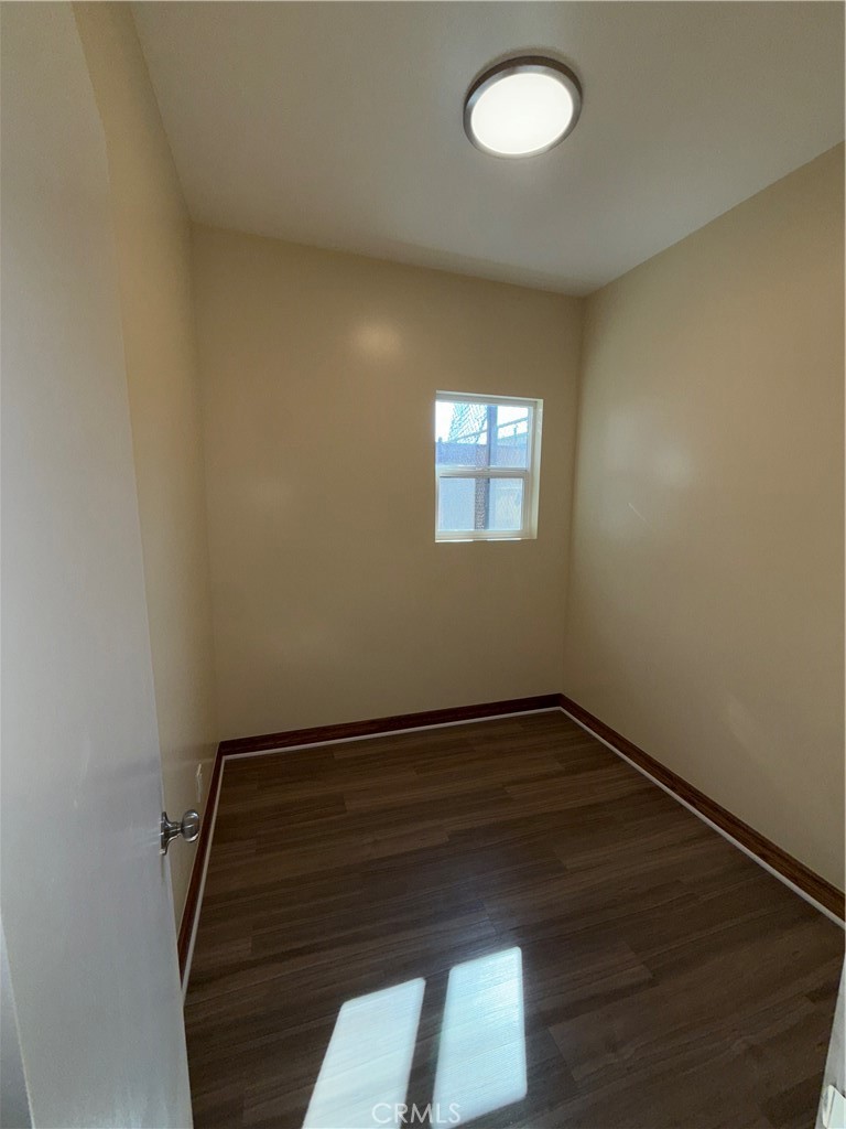 1944 New England Street Los Angeles, CA 90007 - Photo 15 of 18 an empty room with wooden floor and windows