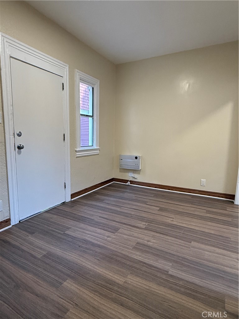 1944 New England Street Los Angeles, CA 90007 - Photo 6 of 18 a view of empty room with wooden floor and fan