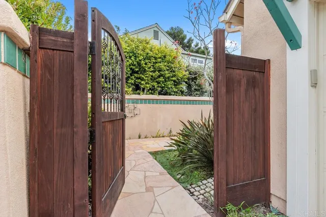 a view of a house with a small yard and plants