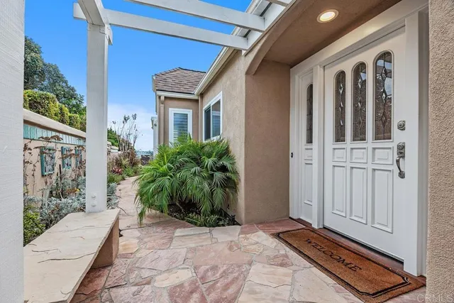 a kitchen with granite countertop a stove top oven a sink a dining table and chairs
