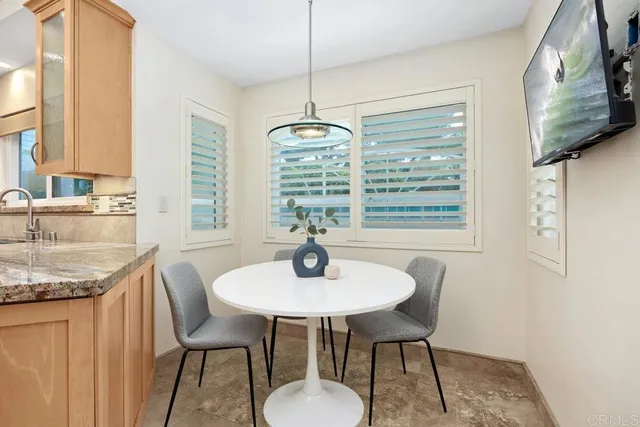 a view of patio with couches and pool