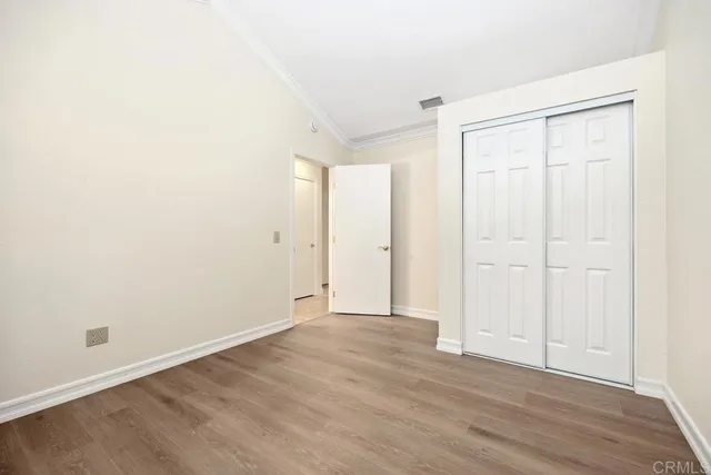 a bathroom with a sink vanity mirror and toilet
