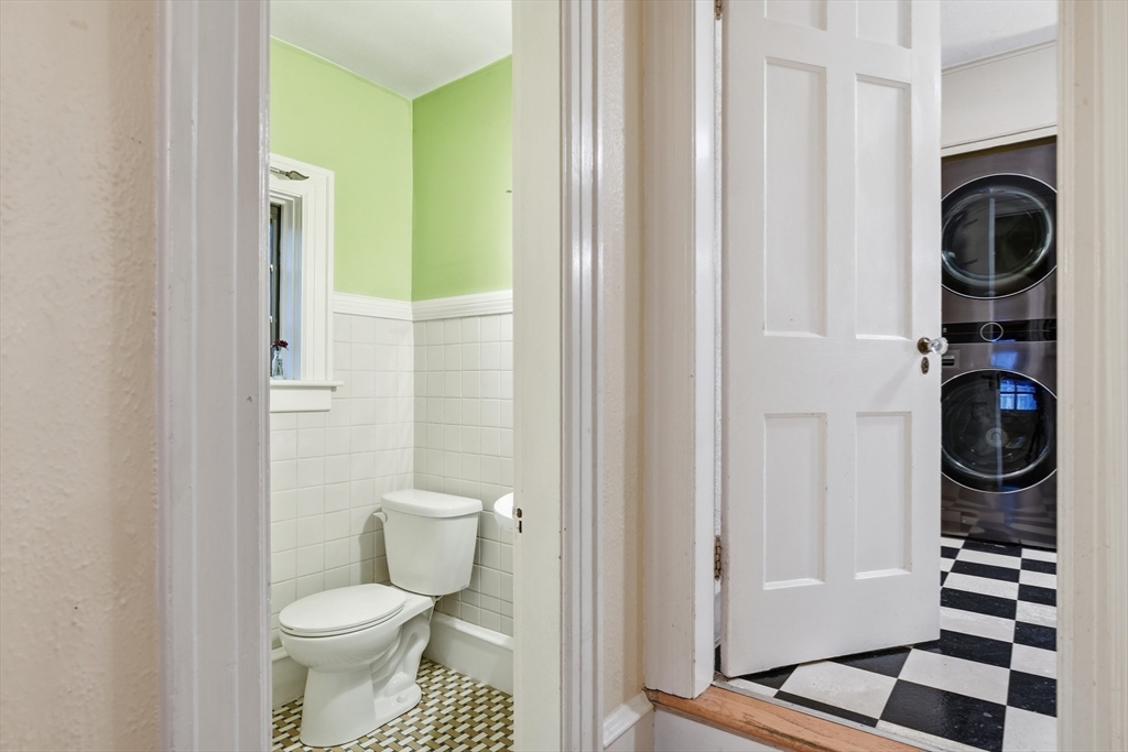 27 Lexington Avenue Holyoke, MA 01040 - Photo 13 of 42 a bathroom with a toilet and a shower curtain