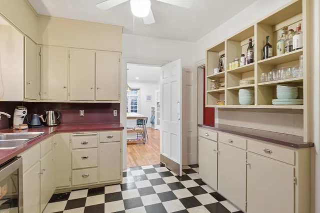 a kitchen with stainless steel appliances a stove a sink and a refrigerator