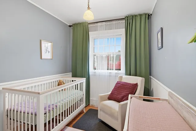 a bedroom with furniture and a window