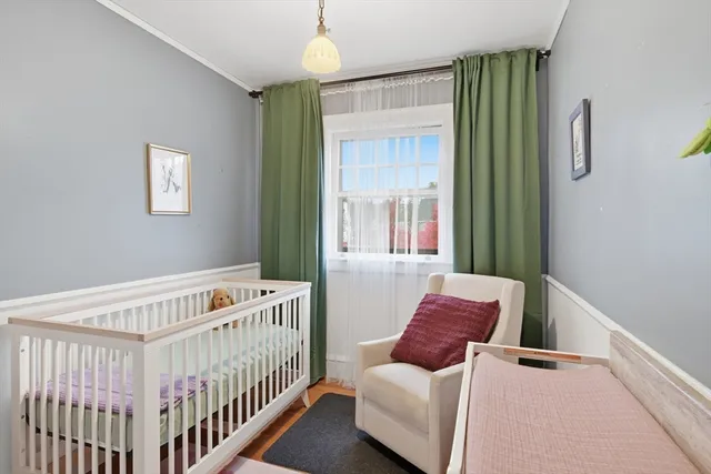 a bedroom with furniture and a window