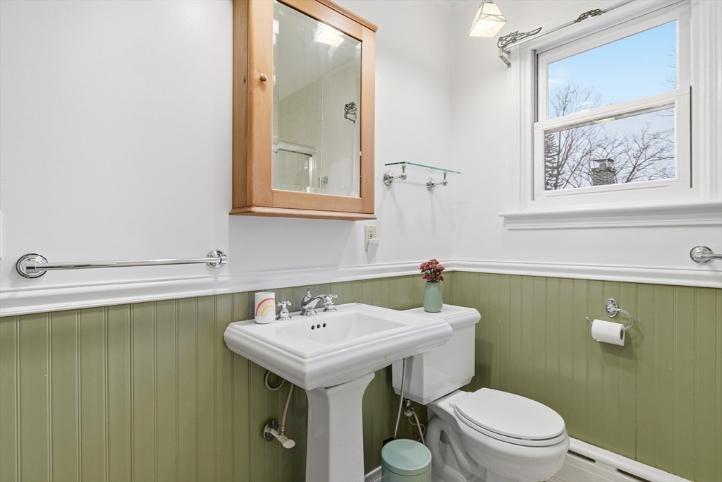 27 Lexington Avenue Holyoke, MA 01040 - Photo 27 of 42 a bathroom with a sink mirror and toilet