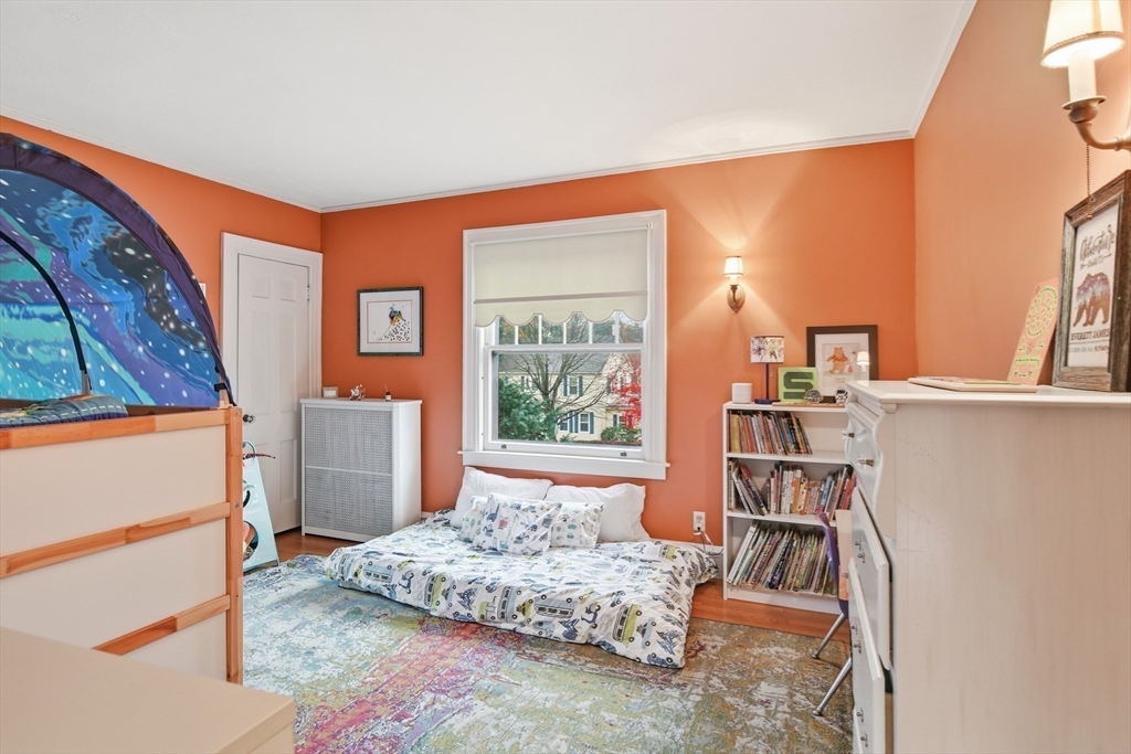 27 Lexington Avenue Holyoke, MA 01040 - Photo 29 of 42 a bedroom with furniture and a book shelf