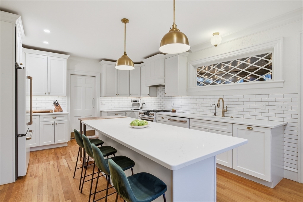 27 Lexington Avenue Holyoke, MA 01040 - Photo 3 of 42 a kitchen with a sink a center island and cabinets