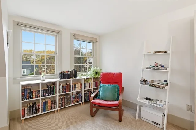 a room with furniture cabinets and window