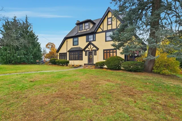 a front view of a house with garden