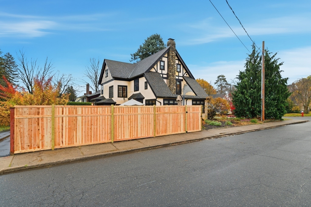 27 Lexington Avenue Holyoke, MA 01040 - Photo 38 of 42 a view of a house with a wooden fence