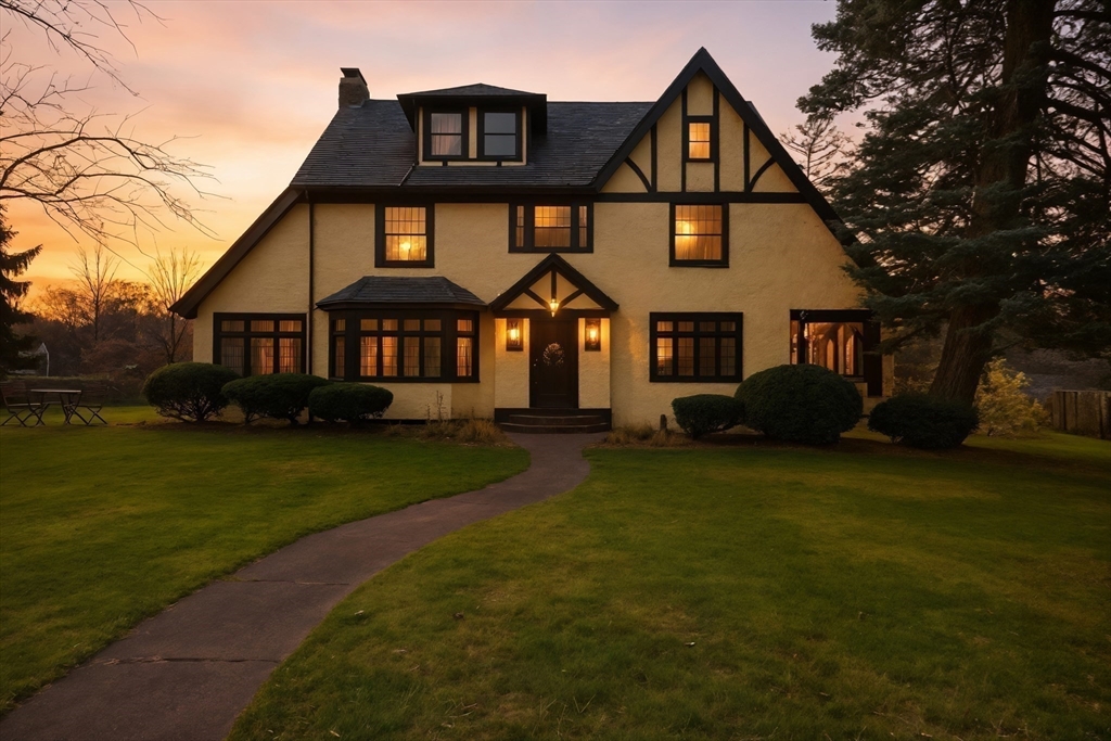 27 Lexington Avenue Holyoke, MA 01040 - Photo 41 of 42 a front view of a house with a garden and trees