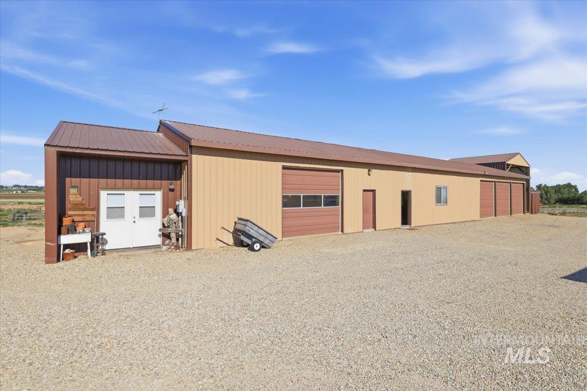 20337 Maggard Lane Caldwell, ID 83607 - Photo 37 of 50 In photo are the shop, craft studio, bunkhouse, 3-bays with roll-up doors, 24T hay storage, and additional storage.