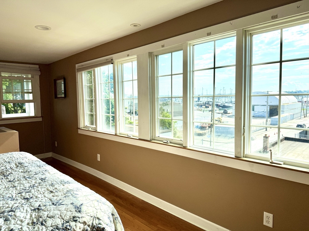16 Middle Street Fairhaven, MA 02719 - Photo 16 of 34 a bedroom with a bed and a window