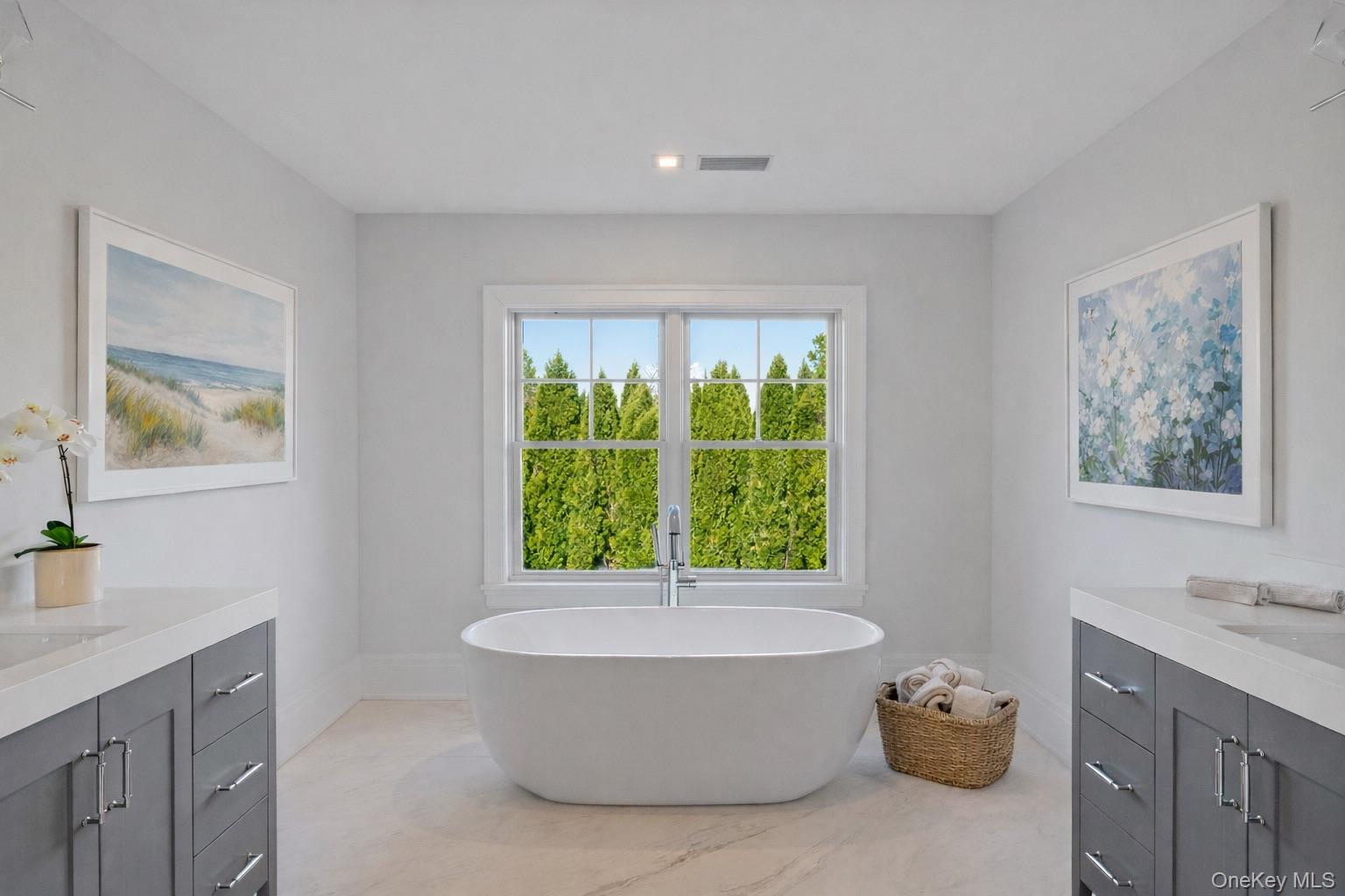 2590 Cox Neck Road Mattituck, NY 11952 - Photo 26 of 50 Spa inspired luxury with radiant heated floors, refined finishes and a calming design that reflects the home's coastal setting