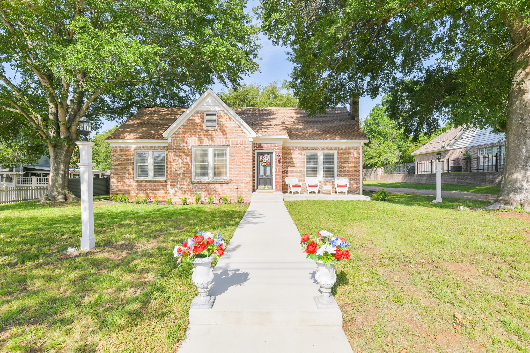 802 South Day Street Brenham, TX 77833 - Photo 1 of 50 front view of a house with a yard