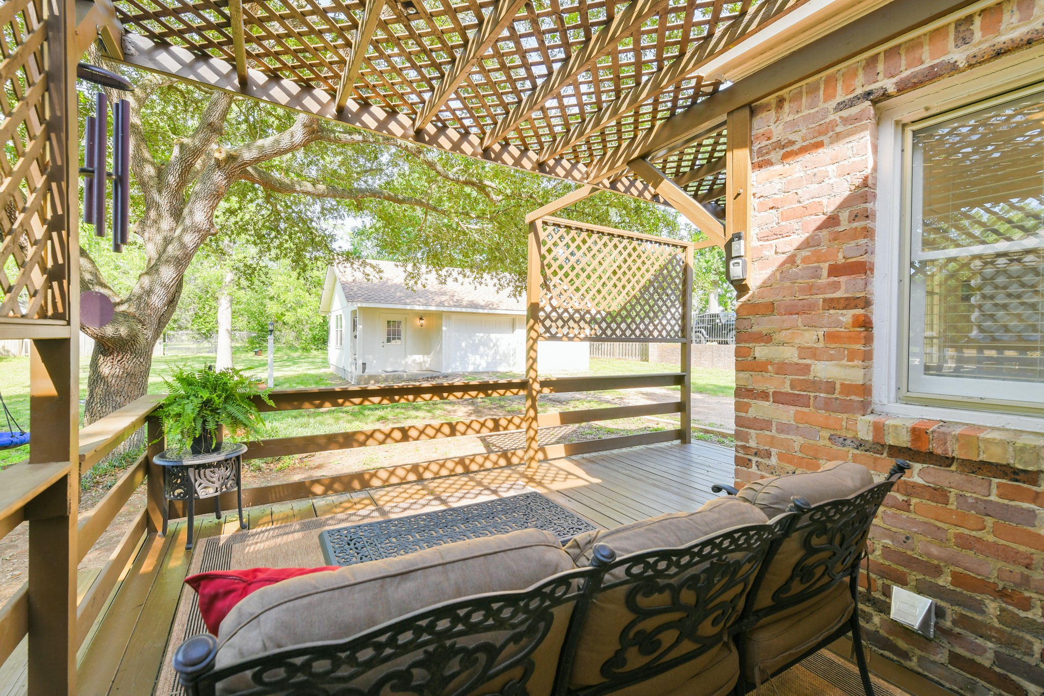802 South Day Street Brenham, TX 77833 - Photo 15 of 50 a view of a patio with table and chairs and potted plants