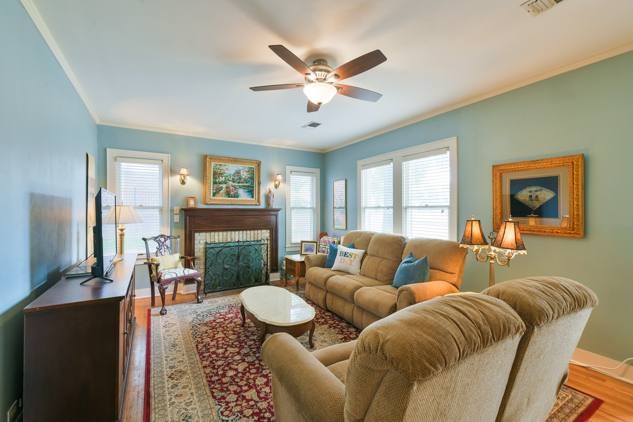 802 South Day Street Brenham, TX 77833 - Photo 19 of 50 a living room with furniture a fireplace and a window