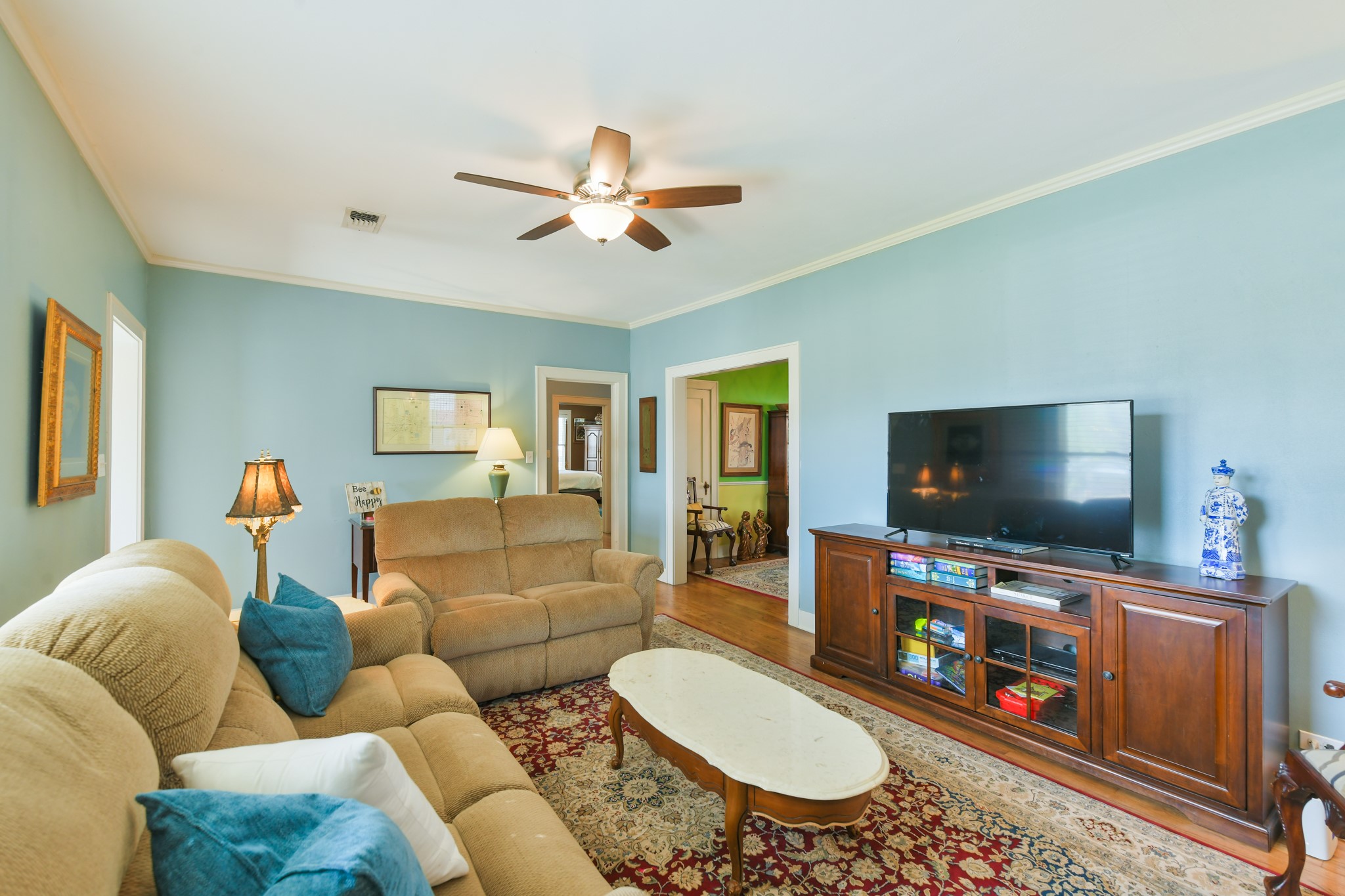802 South Day Street Brenham, TX 77833 - Photo 20 of 50 a living room with furniture and a flat screen tv