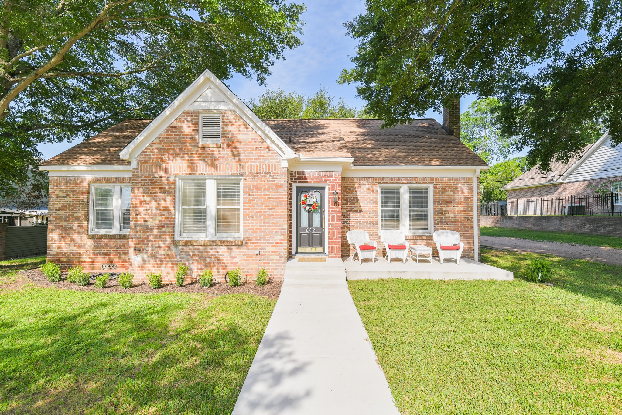 802 South Day Street Brenham, TX 77833 - Photo 2 of 50 front view of a house with a yard