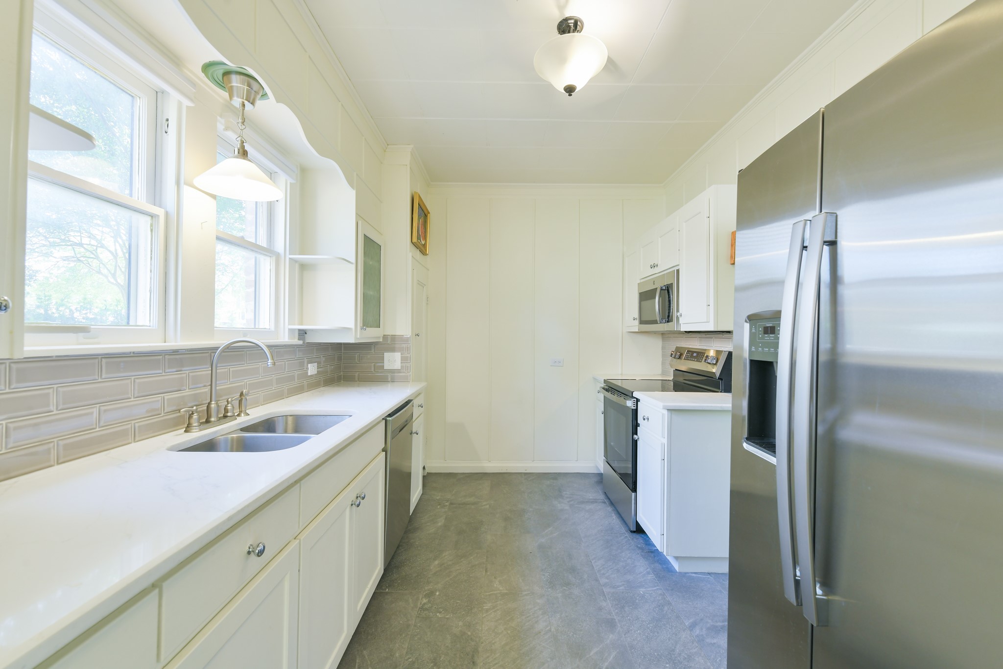 802 South Day Street Brenham, TX 77833 - Photo 26 of 50 a kitchen with a sink stove and refrigerator