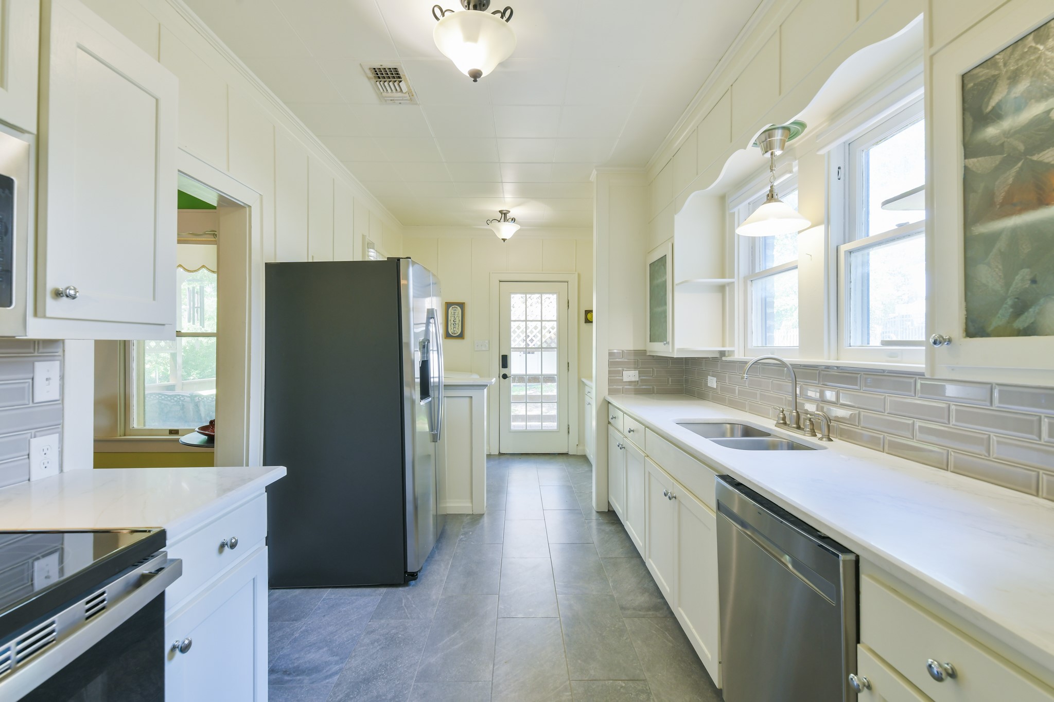 802 South Day Street Brenham, TX 77833 - Photo 27 of 50 a kitchen with a refrigerator sink and stove