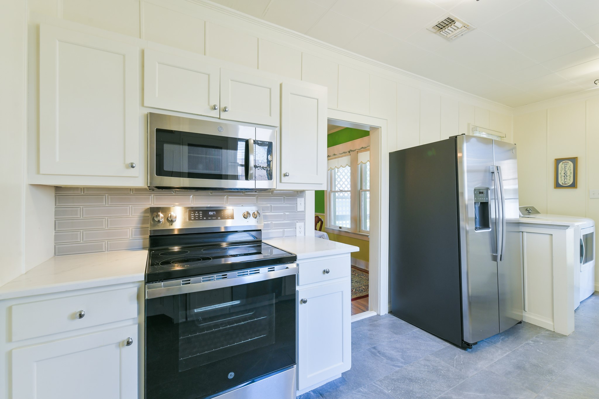 802 South Day Street Brenham, TX 77833 - Photo 28 of 50 a kitchen with a refrigerator stove and microwave