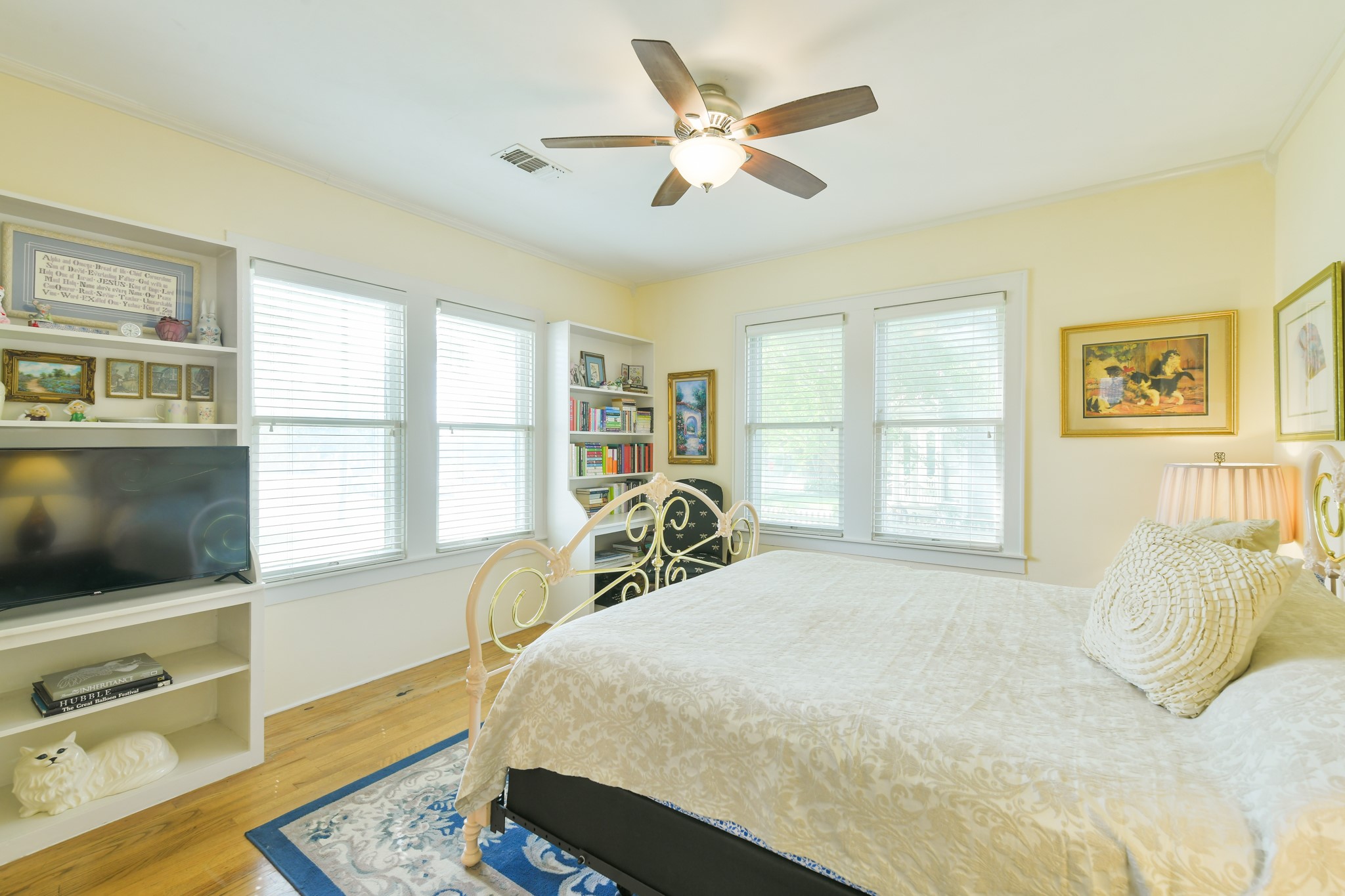 802 South Day Street Brenham, TX 77833 - Photo 35 of 50 a bedroom with a bed a window and a flat screen television