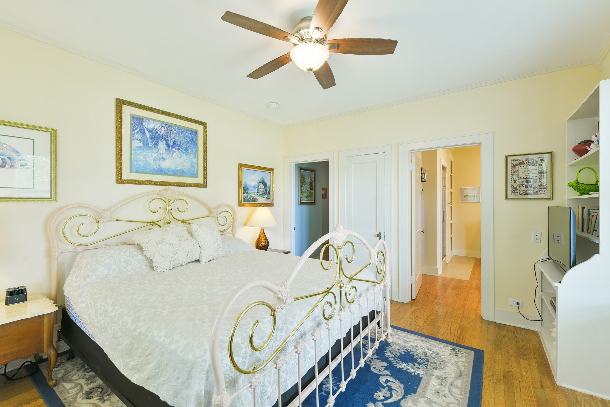 802 South Day Street Brenham, TX 77833 - Photo 37 of 50 a bedroom with a bed and wooden floor
