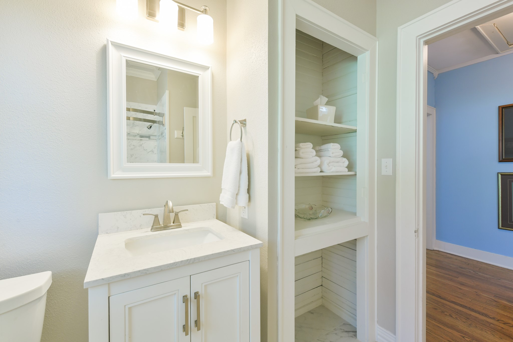 802 South Day Street Brenham, TX 77833 - Photo 46 of 50 a bathroom with a sink and a mirror