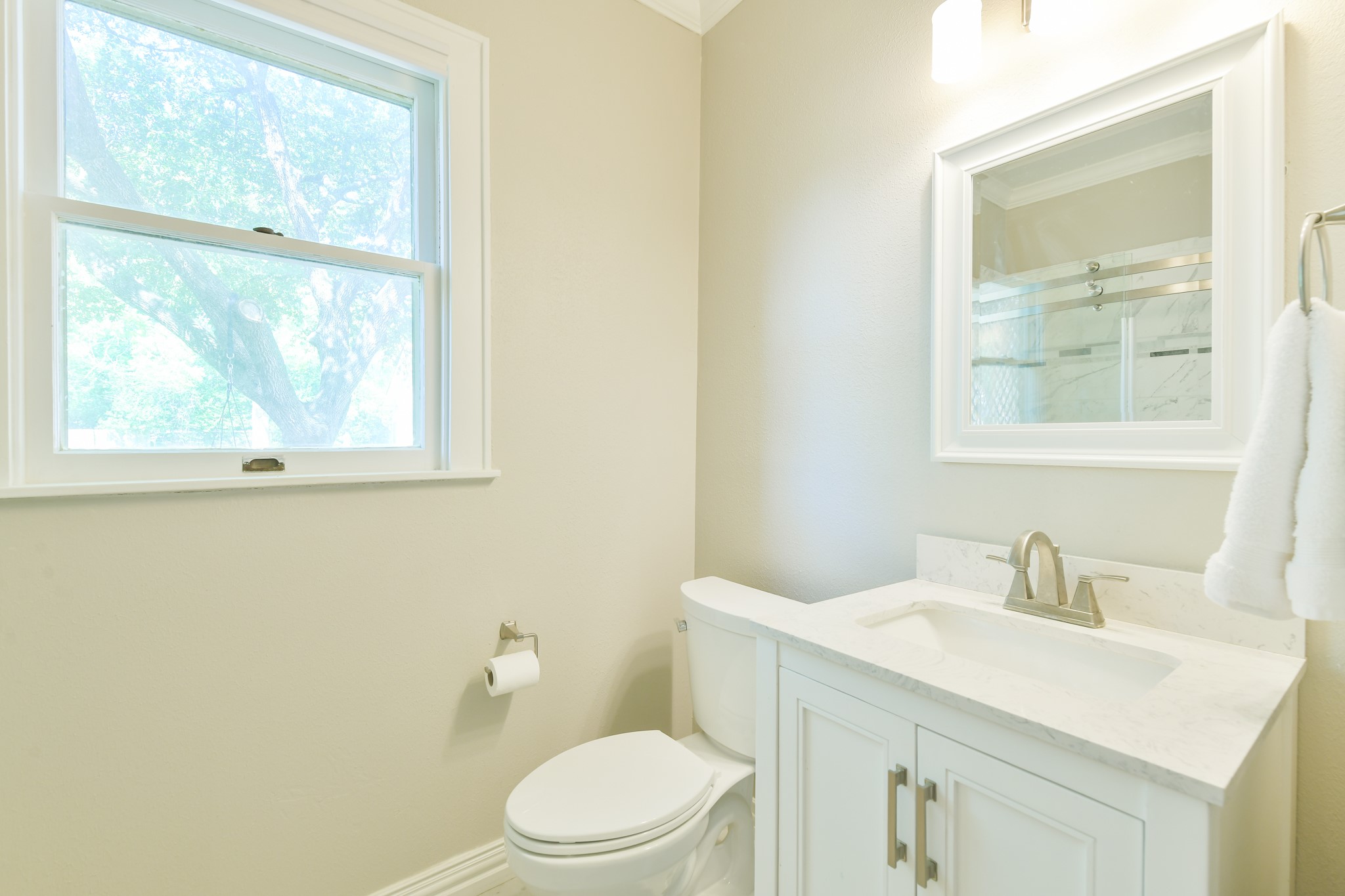 802 South Day Street Brenham, TX 77833 - Photo 47 of 50 a bathroom with a sink a toilet and a window