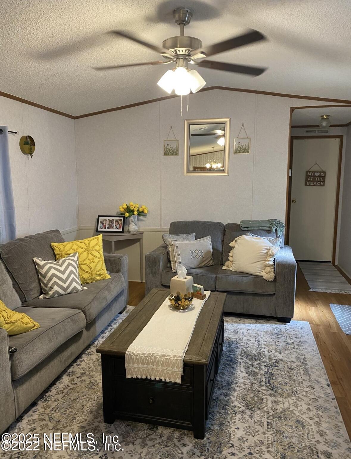 86266 Weldon Road Yulee, FL 32097 - Photo 2 of 10 a living room with furniture and a couch