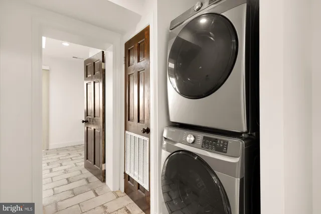 a view of a hallway with washer and dryer