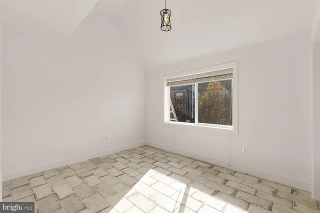 a view of a room that has a window in it