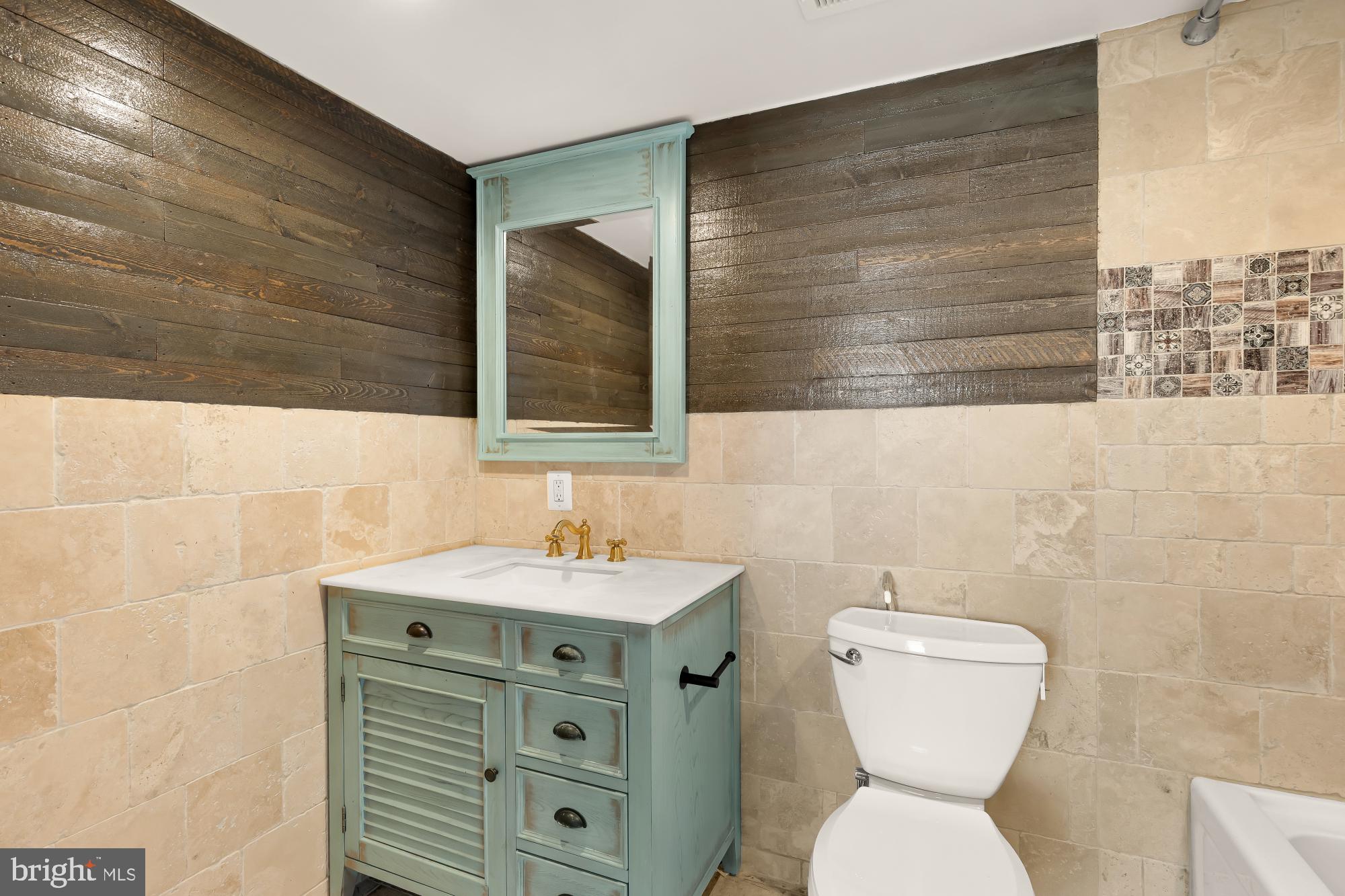 1210 Meigs Place Northeast Washington, DC 20002 - Photo 19 of 41 a bathroom with a toilet sink and mirror
