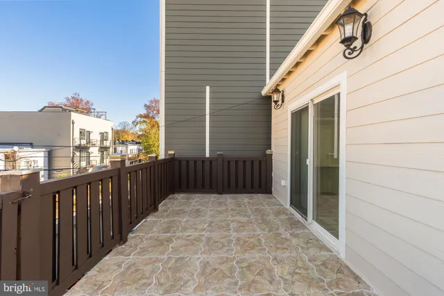 a view of a deck with barbeque grill wooden floor and fence