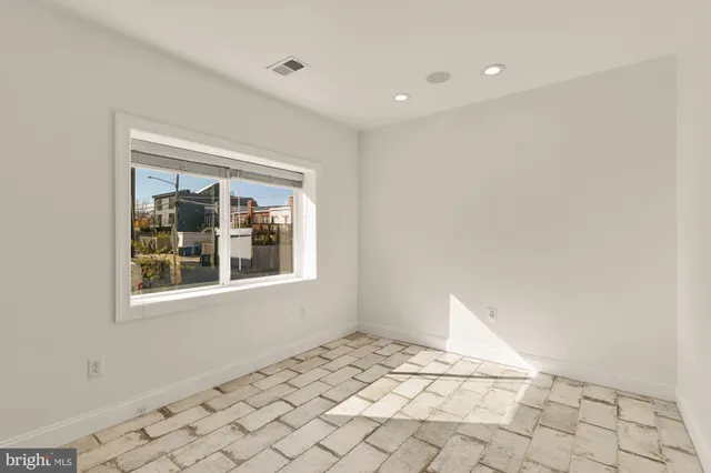 a view of an empty room and window