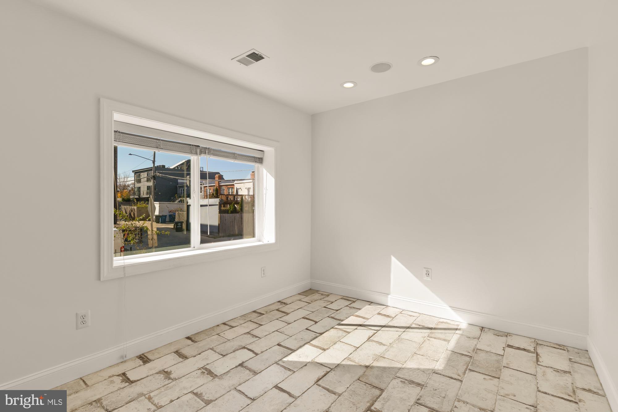 1210 Meigs Place Northeast Washington, DC 20002 - Photo 32 of 41 a view of an empty room with a window