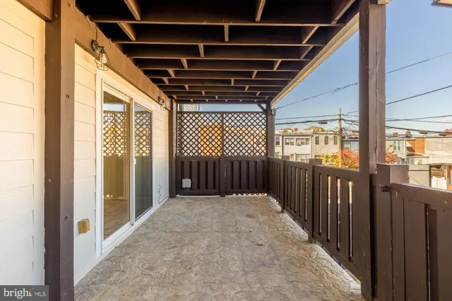 a view of a patio with table and chairs