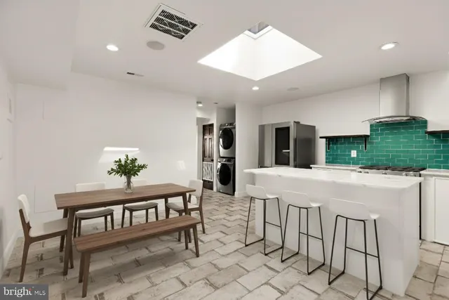 a dining room with furniture and window