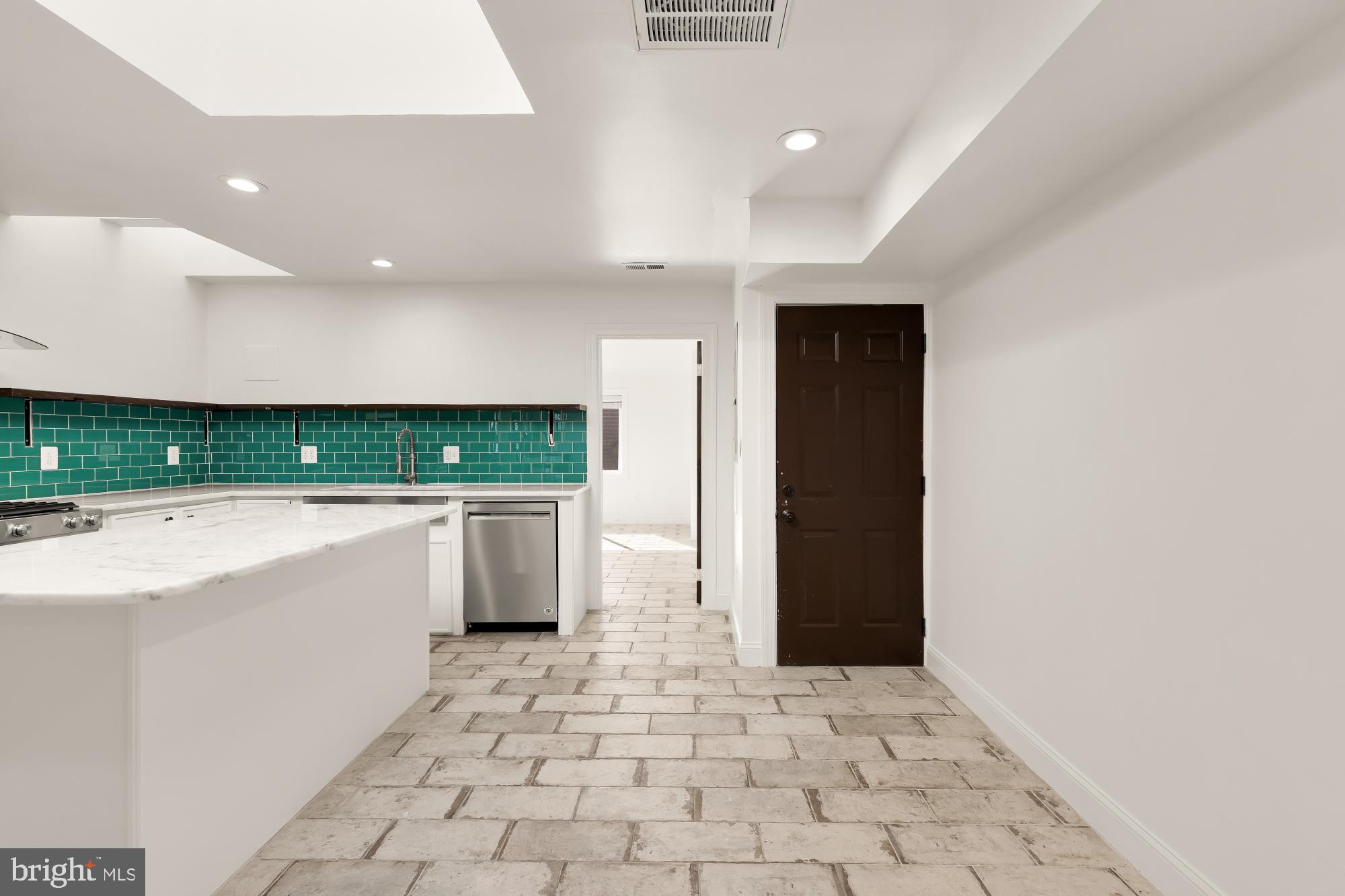 1210 Meigs Place Northeast Washington, DC 20002 - Photo 7 of 41 a kitchen with a sink a counter top space and cabinets