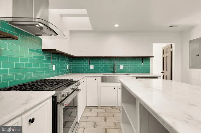 a kitchen with a refrigerator and a sink