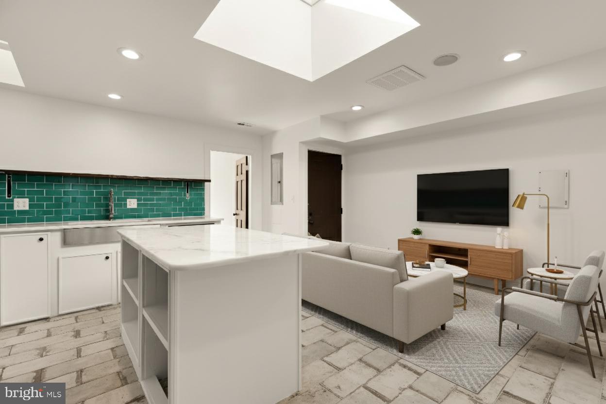 1210 Meigs Place Northeast Washington, DC 20002 - Photo 10 of 41 a living room with kitchen furniture and a flat screen tv