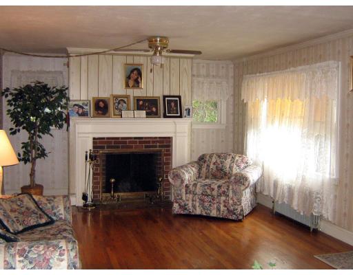 30 Oconnell Road Boston, MA 02124 - Photo 8 of 9 a living room with furniture and a fireplace