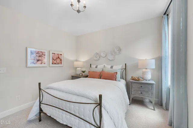 a bedroom with a bed and a night stand