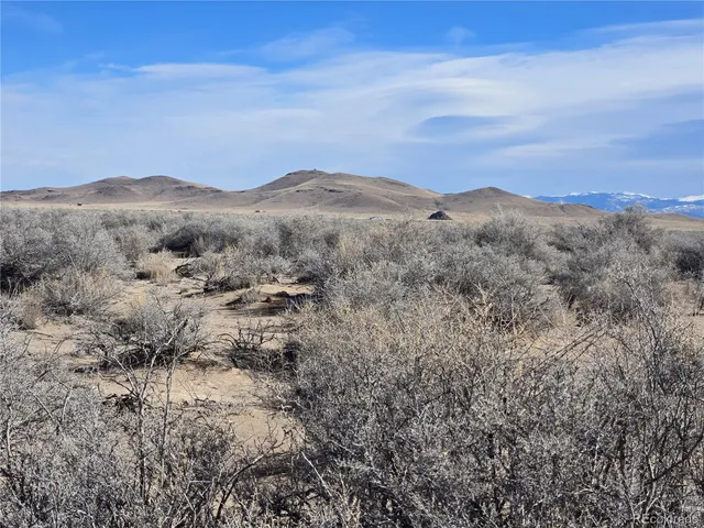 a view of mountain view with mountains in the background