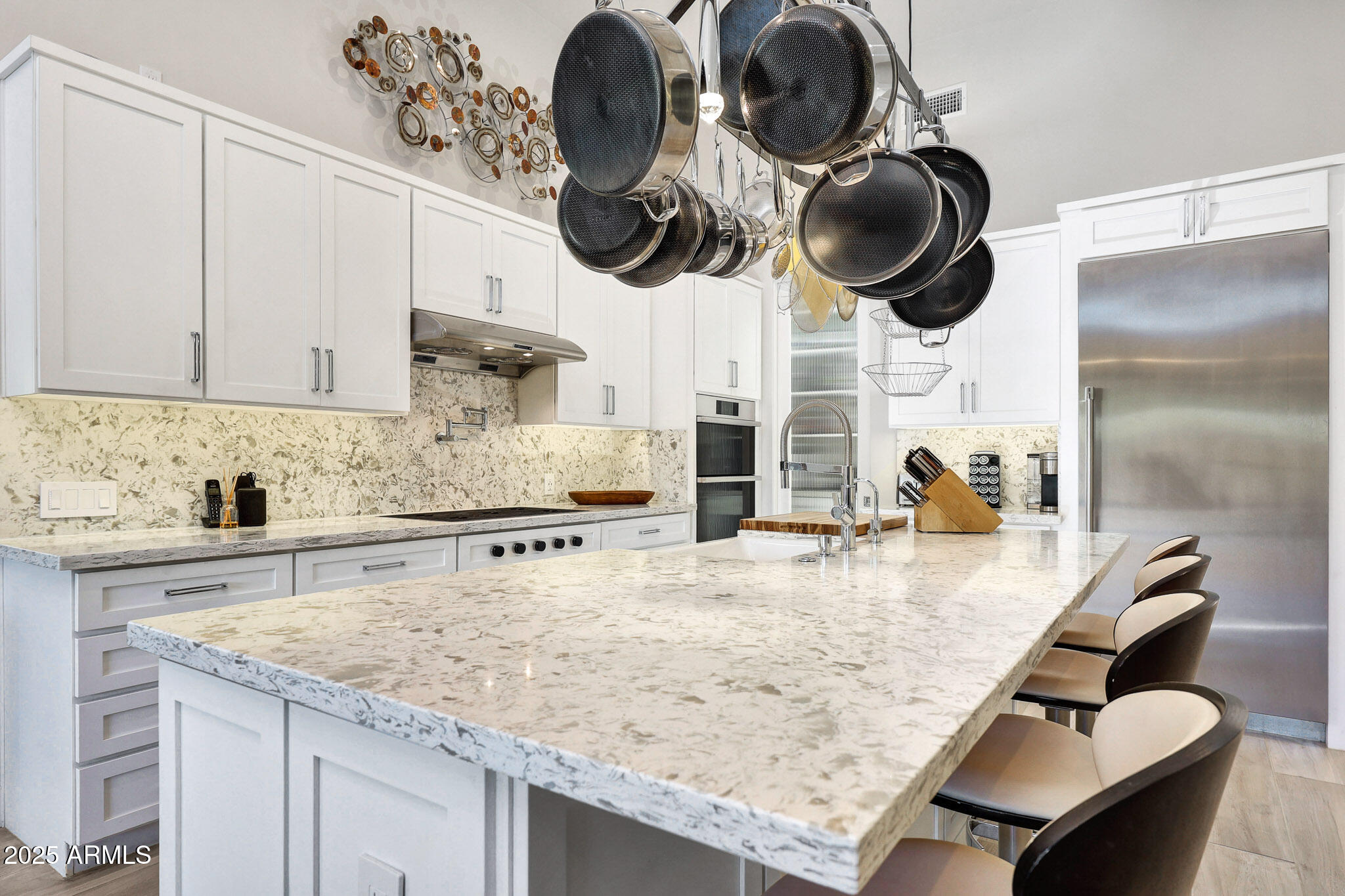 9850 East McDowell Mountain Ranch Road, Unit 1019 Scottsdale, AZ 85260 - Photo 12 of 66 a kitchen with kitchen island granite countertop cabinets a stove and a sink